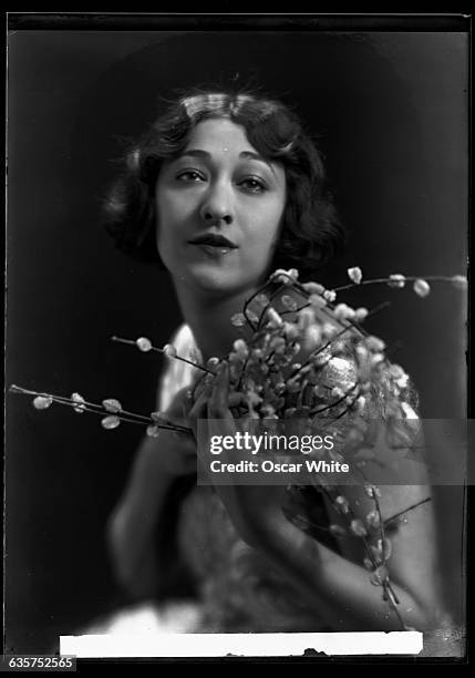 Portrait of one of the twin Dolly sisters, who were a world famous singing act.