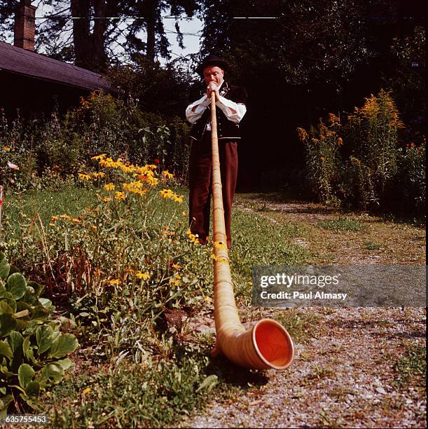 An alp horn or alpenhorn, a wood wind instrument used in the Swiss Alps.