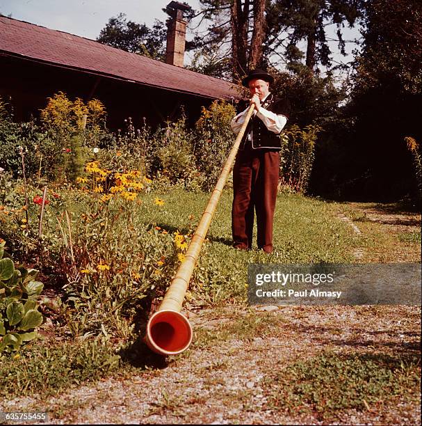 An alp horn or alpenhorn, a wood wind instrument used in the Swiss Alps.