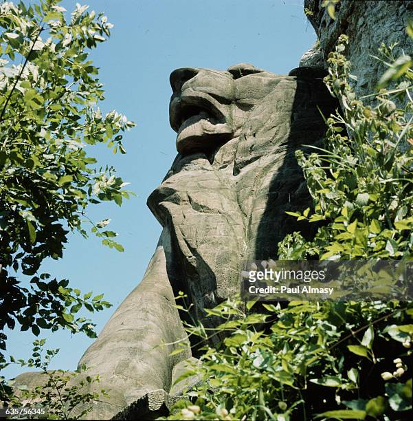Stone statue of a lion, located in Belfort, France. | Detail of: 'Lion of Belfort' by Frederic Bartholdi.