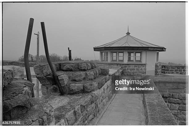 Exterior of a stone guard tower at Mauthausen, a Nazi concentration camp in operation during World War II. Over 100,000 prisoners died while confined...