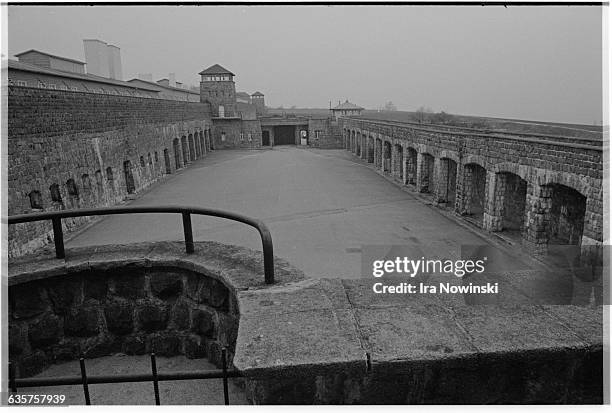 Guard towers and barracks surround the prisoner courtyard at Mauthausen, a Nazi concentration camp in operation during World War II. Over 100,000...