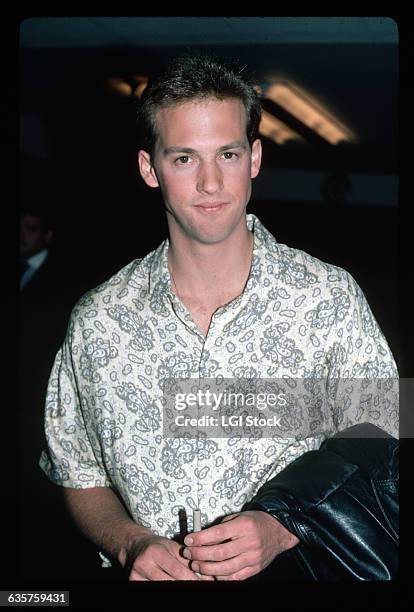 Waist-up shot of Anthony Edwards, wearing a paisley shirt. Undated photograph.