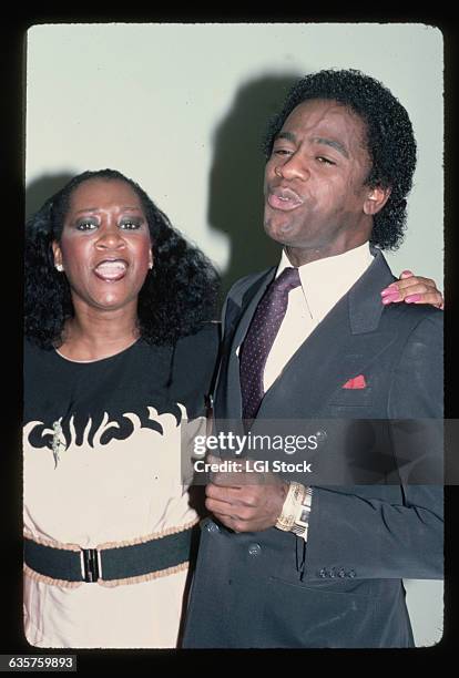 Photo shows Patti LaBelle and Al Green, soul and gospel singers, singing together.