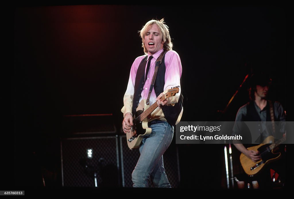 Tom Perry Tom Petty sings and plays guitar in his band, Tom Petty and the... News ...