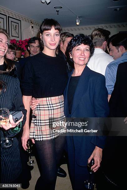 New York, New York: Picture shows model, Christy Turlington, with her arm around her mother backstage at the Burberry's fashion show. Christy is...