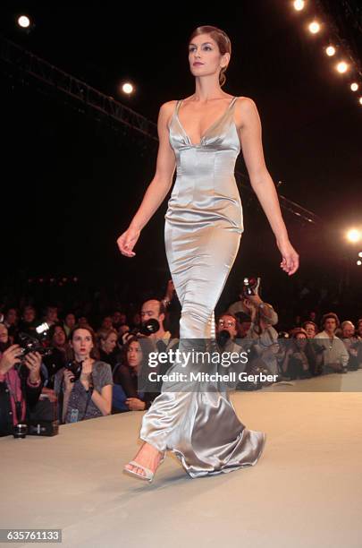 Cindy Crawford models a silver evening gown for Richard Tyler's Spring line.