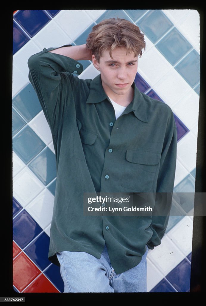 Los Angeles CA Jonathan Brandis Posing In Front Of A White And Blue los-angeles-ca-jonathan-brandis-posing-in-front-of-a-white-and-blue