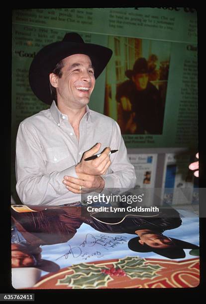 Photo shows Clint Black as he signs autographs for fans in Nashvillle, TN.
