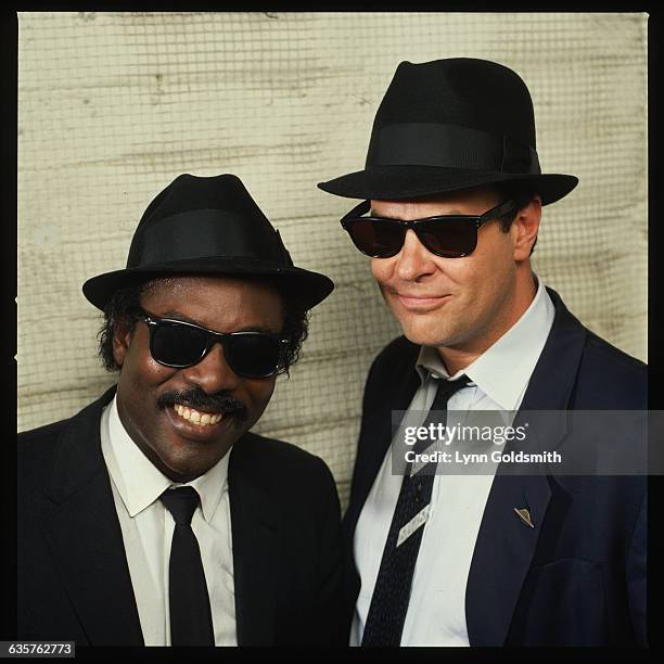 Dan Aykroyd, dressed as Elwood Blues from the movie The Blues Brothers, with singer Sam Moore.