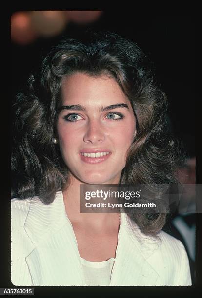Actress/model Brooke Shields is shown smiling in this head and shoulders portrait.