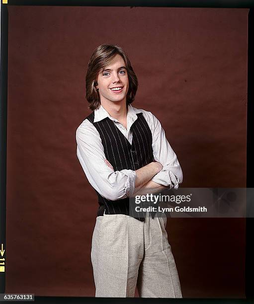 Studio portrait of Shaun Cassidy. He is shown in a 3/4-lenght view, with his arms crosssed. Undated photograph.
