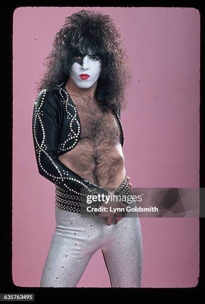 Musician Paul Stanley of the glam-rock band "Kiss" poses in his make-up. He is wearing a cropped, rhinestone-studded jacket, no shirt, and tight...