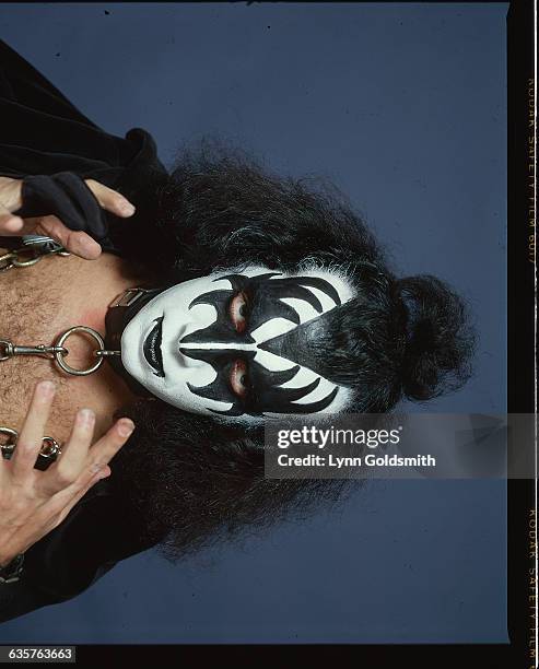 Photo shows Gene Simmons, bassist with the rock and roll group KISS, in full make-up and in costume, in this studio portrait. Ca. 1980s.