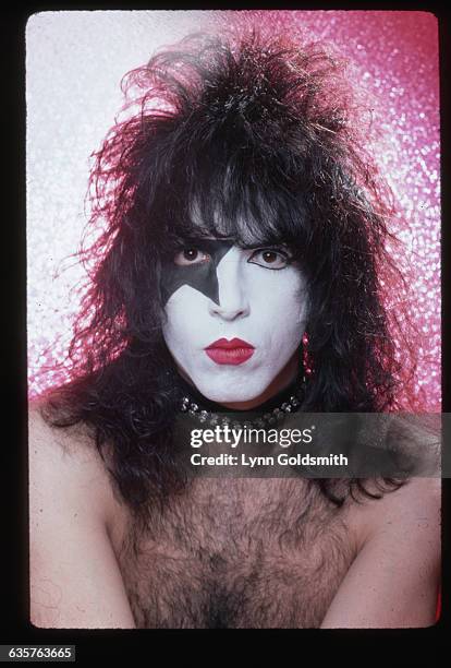 Headshot of musician Paul Stanley of the glam-rock band "Kiss" wearing his make-up for stage. He is shirtles and alone. Photo circa 1980.