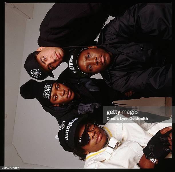 The rap group N.W.A are shown in a studio pose. From left to right: Eazy-E , Dr. Dre, MC Ren and DJ Yella.