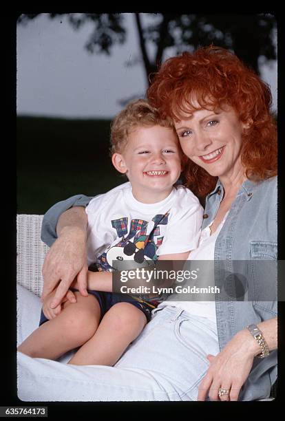 Country singer Reba McEntire hugs her young son Shelby.