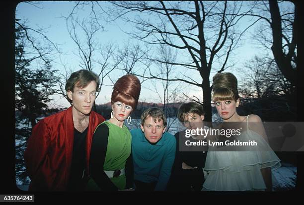 The members of the new wave band the B-52s pose outdoors in front of a lake. From left to right: Fred Schneider , Kate Pierson , Ricky Wilson , Keith...