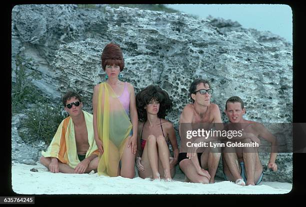 The members of the new wave band the B-52s pose in bathing suits