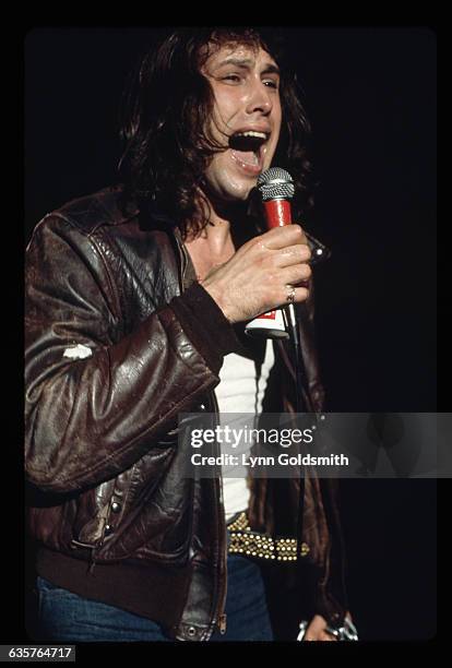 Actor/comedian Chevy Chase is shown with long hair, in a scene from a skit on the TV show "Saturday Night Live." Ca. 1970s.