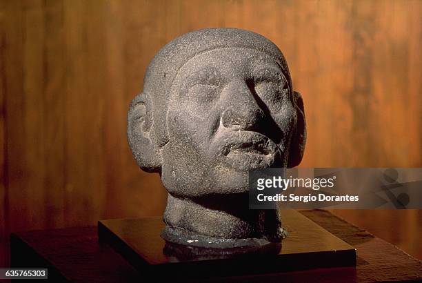 An Aztec head carved from basalt stone, at the Museum of Anthropology in Mexico City, Mexico. | Located in: Museo Nacional de Antropologia.