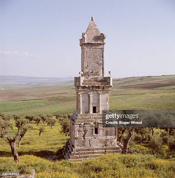 Lybico-Punic mausoleum stands at the site of Dougga, overlooking rolling farmland in the hills of northern Tunisia. It dates from the Punic period in...