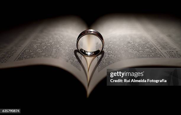 heart shape shadow over the bible - fotografia photos stock pictures, royalty-free photos & images