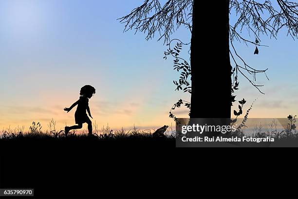 child playing behind a frog - frog silhouette stock pictures, royalty-free photos & images