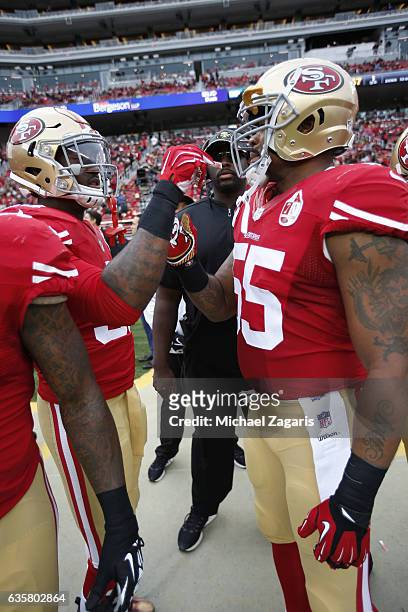 Gerald Hodges of the San Francisco 49ers gives Ahmad Brooks a poper on the sideline prior to the game against the New York Jets at Levi Stadium on...