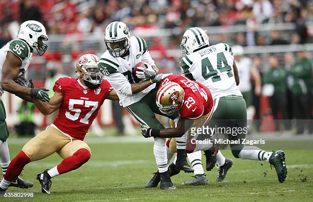 Michael Wilhoite and Jaquiski Tartt of the San Francisco 49ers tackle Nick Marshall of the New York Jets during the game at Levi Stadium on December...