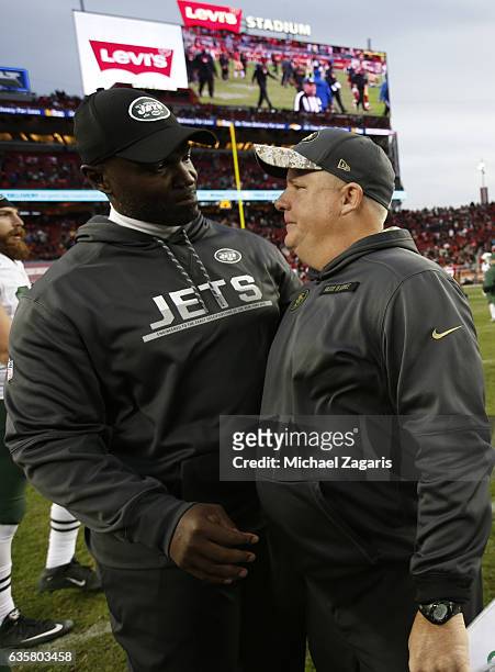 Head Coach Todd Bowles of the New York Jets and Head Coach Chip Kelly the San Francisco 49ers talk on the field following the game at Levi Stadium on...