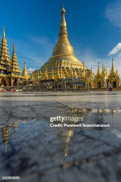 reflection of shwedagon pagoda, yangon city, myanmar - shwedagon pagoda stock pictures, royalty-free photos & images