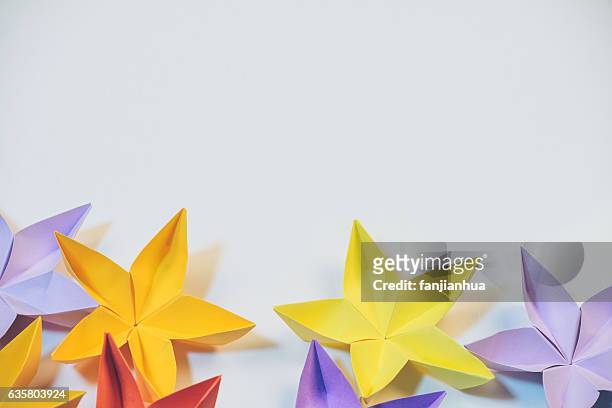 close-up of paper flower against white background - origami flower stock pictures, royalty-free photos & images