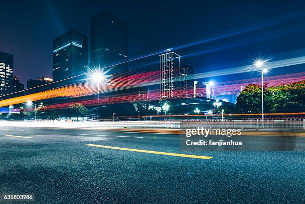 traffic road in downtown of hong kong - night road blur stock pictures, royalty-free photos & images