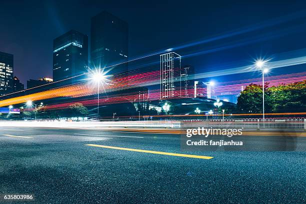 traffic road in downtown of hong kong - long exposure street stock pictures, royalty-free photos & images