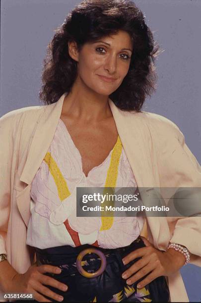 Italian comedian Anna Marchesini posing for a studio photo shooting. Italy, 1985