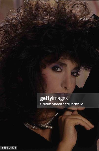 Close-up of Italian comedian Anna Marchesini for a studio photo shooting. Italy, 1986