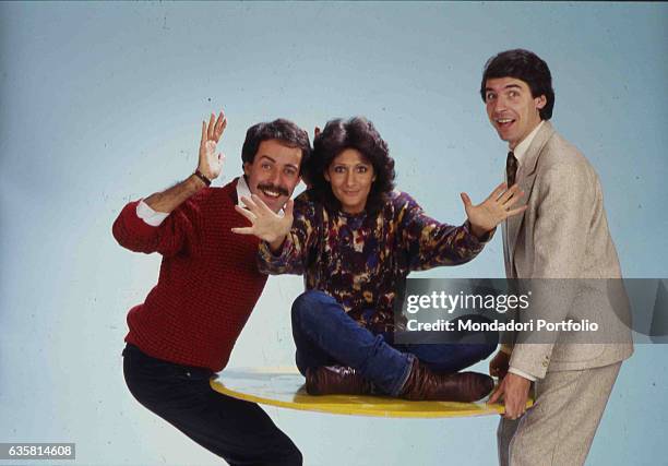 The comic trio formed by Massimo Lopez, Anna Marchesini and Tullio Solenghi posing for a photo shooting. Italy, 1985