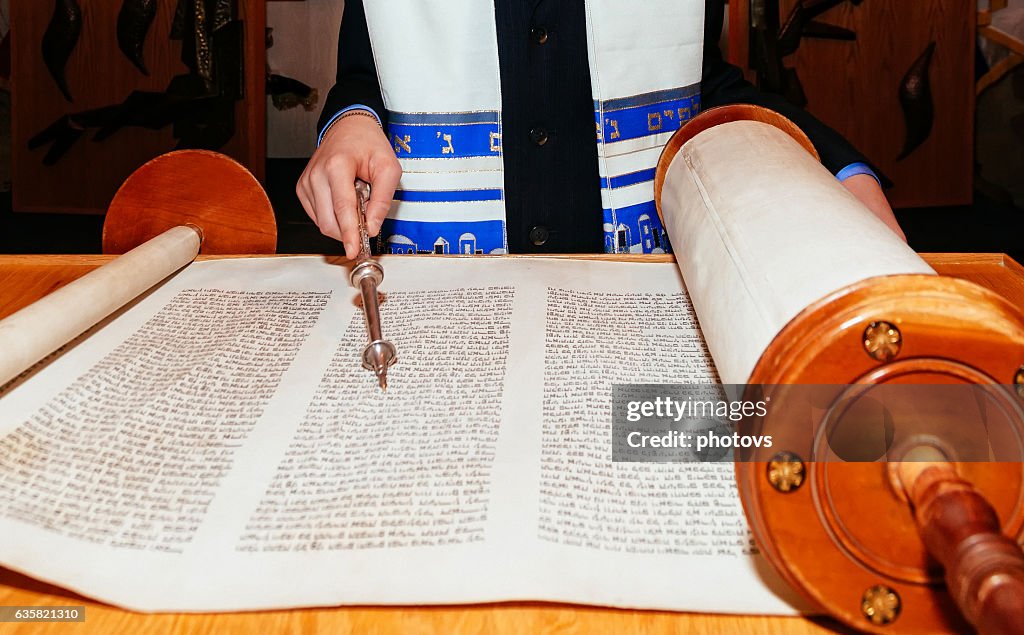 Jewish man dressed in ritual clothing Torah at Bar Mitzvah