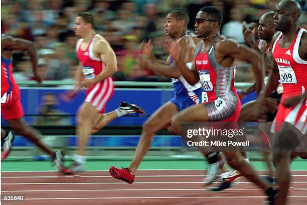Ato Boldon of Trinidad and Tobago speeds during the Men's 100m races at the Olympic Stadium for the Sydney 2000 Olympic Games in Sydney,...