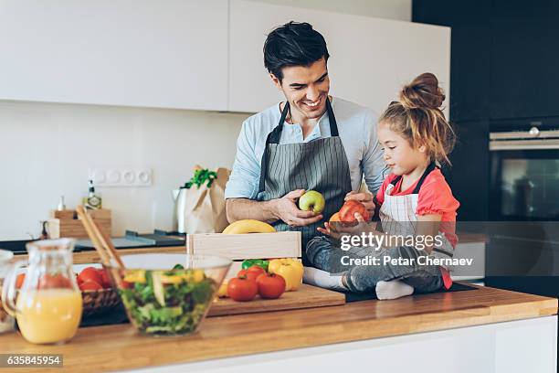 healthy food for the family - unpacking home stock pictures, royalty-free photos & images