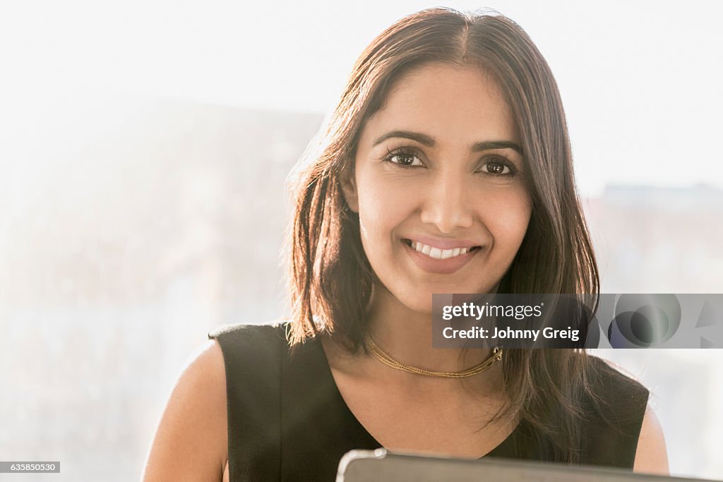 Mid adult businesswoman smiling towards the camera