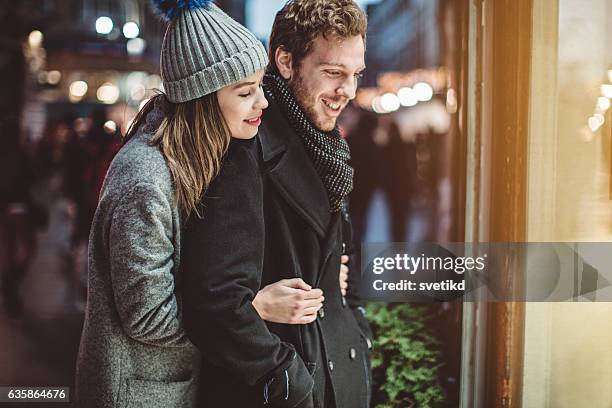 strolling thru the city - window shopping stock pictures, royalty-free photos & images