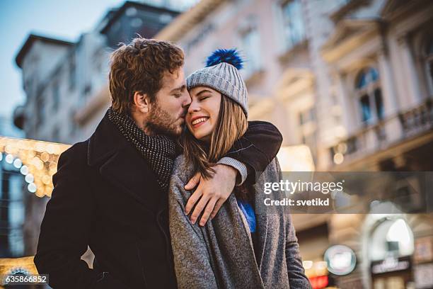 they adore each other - couple winter stock pictures, royalty-free photos & images