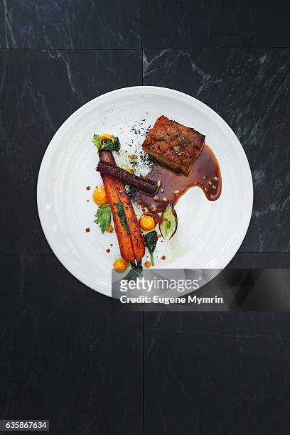 pork belly and vegetables with demi-glace sauce - gourmet stock pictures, royalty-free photos & images