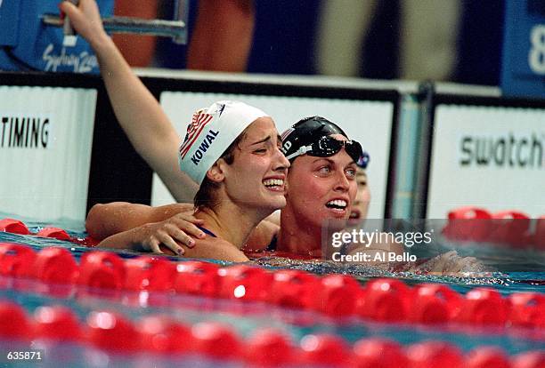 Amanda Beard of the USA hugs Kristy Kowal after winning Second and Third in the Womens 200m Breaststroke Final Event during the Sydney 2000 Olympic...