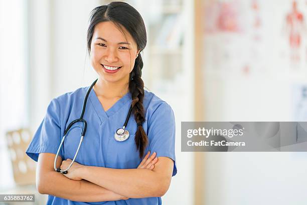 krankenschwester tun ihre runden - nurse and portrait and white background and smiling and female and looking at camera stock-fotos und bilder