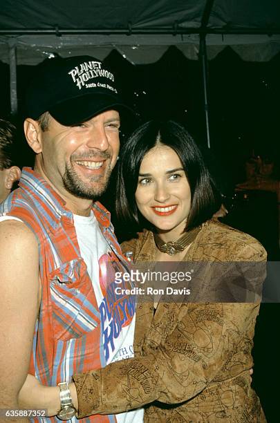 Actress Demi Moore and actor Bruce Willis attend the Planet Hollywood Grand Opening Celebration on October 23, 1992 at Planet Hollywood, South Coast...