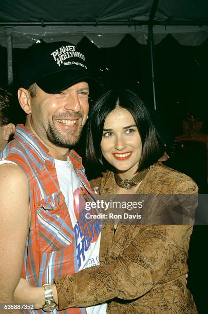 Actress Demi Moore and actor Bruce Willis attend the Planet Hollywood Grand Opening Celebration on October 23, 1992 at Planet Hollywood, South Coast...