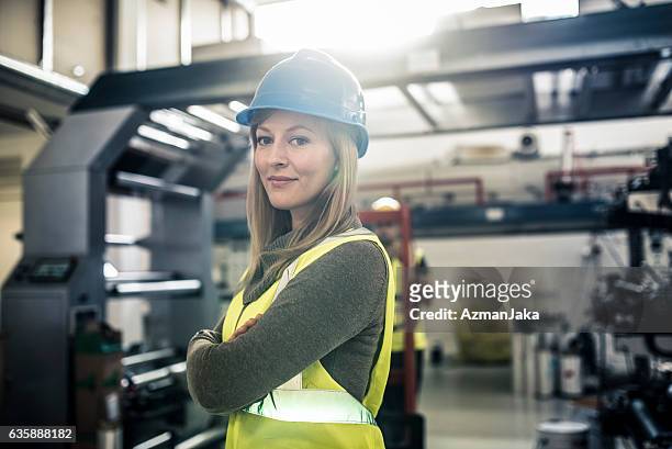 i'm the boss at this construction site - factory engineer woman stockfoto's en -beelden